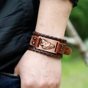 Close-up of retro wolf head leather bracelet, detailed woven texture and metal accent.