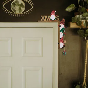 Christmas wooden door corner decoration, festive gnome hanging ornament for holiday home setup.