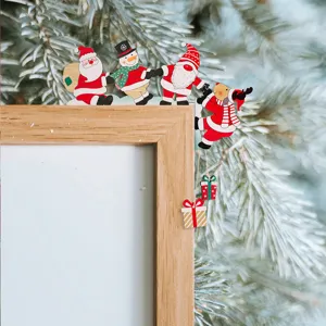 Wooden Christmas door frame corner decoration with cute Santa snowman reindeer and hanging gifts.