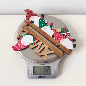 Christmas wooden gnome door frame decoration detail view, showing product craft clearly.