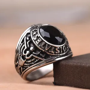 Retro men's alloy eagle ring with black gemstone, detailed military style close-up shot.