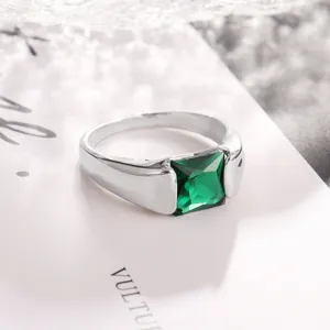 Minimalist silver ring featuring a stunning square green gemstone, detailed close-up shot.