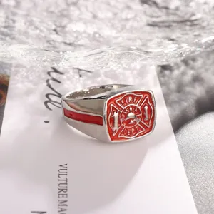Detailed close-up of the vintage men's alloy ring featuring a bold red fire department emblem.