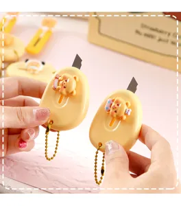 Cute cartoon yellow bear utility knife, portable mini pocket craft cutter for daily use.