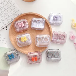 Schattige snoepkleur strik contactlenzenhouder draagbare transparante doos met verzorging.