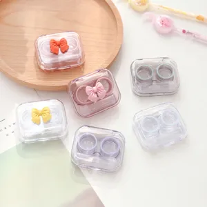 Leuke snoepkleur strik contactlens etui draagbare transparante reisbox set voor dagelijks.