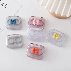 Schattige snoepkleur strik contactlens etui draagbare transparente metgezel doos voor thuis.