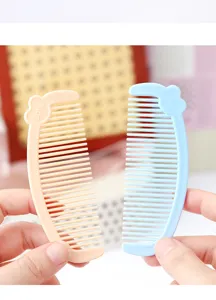 Mini cute plastic hair comb detail showing portable dual-color children design and smooth teeth.