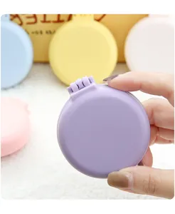 Mini brosse à cheveux coussin d'air pliante portable avec miroir, peigne de voyage couleur bonbon.