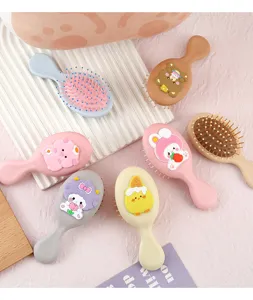 Adorable mini brosse à cheveux coussin d'air dessin animé portable pour fille et étudiant.