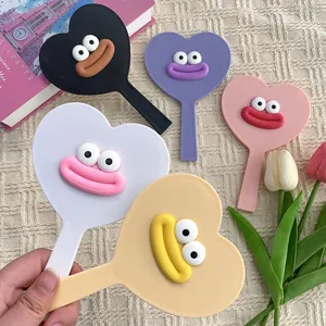 Cute heart-shaped handheld makeup mirror with funny big lips design, perfect for daily use.