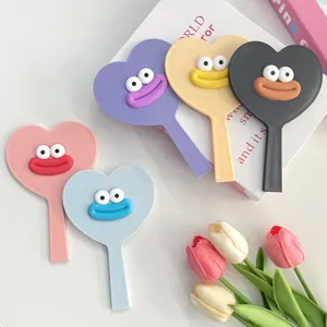Cute heart-shaped hand makeup mirror with funny cartoon big mouth design, portable vanity mirror.