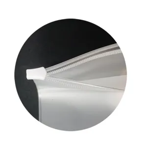 Close-up detail of clear PVC binder zipper pouch showing white slider and smooth track.