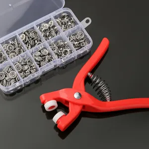 Snap fastener installation kit with red hand press plier and storage box for clothes.