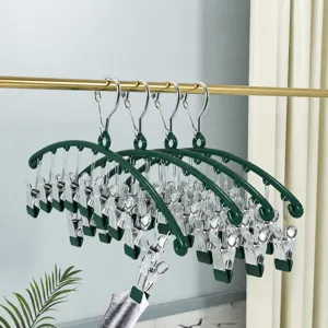 Multi-clip sock drying rack for baby underwear, curved plastic hanger with strong metal clips.