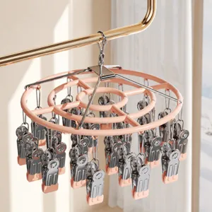 Séchoir à chaussettes rond en acier inoxydable avec pinces pour le balcon et la maison.