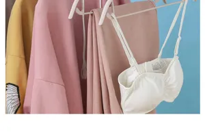 Traceless clothes hangers with anti-slip shoulder design, perfect for home wardrobe organization.