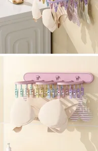 Foldable wall-mounted clothes drying rack with multiple clips for socks and underwear use.