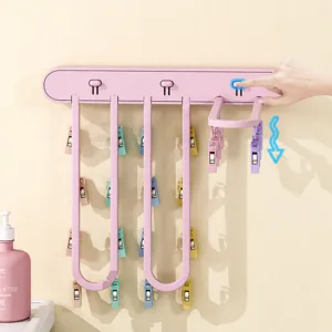 Wall-mounted foldable drying rack for socks and clothes, punch-free indoor balcony space saver.