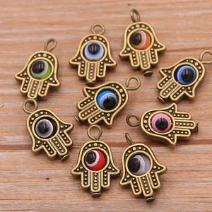 Details of antique bronze Hamsa hand evil eye charms, colorful resin eyes for DIY jewelry.
