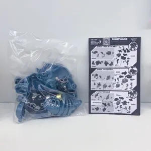 Detailed view of DINOWARS mecha dinosaur building kit with blue parts and instruction manual.