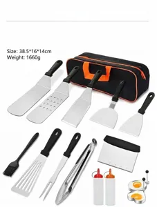 Stainless steel outdoor camping BBQ grilling tool set with various spatulas and portable storage bag.