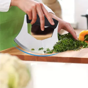Stainless steel herb chopper knife in use, sharp mezzaluna blade for kitchen prep.