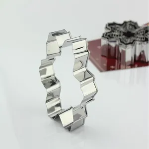 Stainless steel snowflake cookie cutter detail, metal baking mold for DIY pastry biscuits.