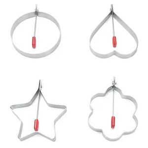 Stainless steel egg ring mold detail showing multiple cute shapes like heart, star and flower.