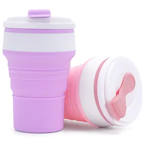 Collapsible silicone travel coffee mug in pink and white, portable folding cup for outdoor use.
