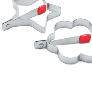 Stainless steel egg frying mold with red silicone handle, cute star and flower shapes.