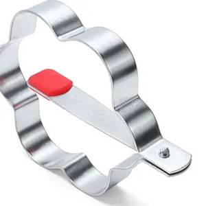 Stainless steel fried egg mold detail view, showing durable 304 material and red handle grip.