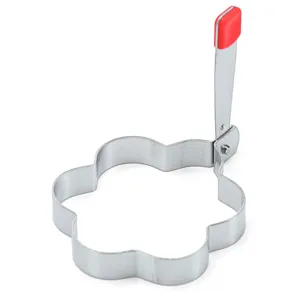 Stainless steel flower egg ring detail, folding handle with red cover, kitchen tool closeup.