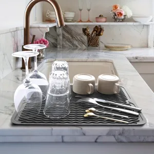 Silicone dish drying mat detail view, corrugated non-slip surface for kitchen countertop.