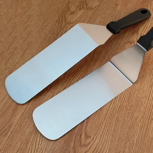 Stainless steel grill spatula detail view, durable teppanyaki turner tool for outdoor BBQ.