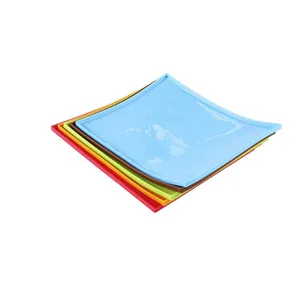 Silicone baking mat detail showing stacked square raised edge trays in colorful kitchen options.