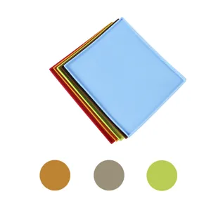 Detailed view of stacked colorful silicone baking mats with raised edges for kitchen use.