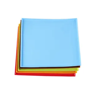 Colorful silicone baking mat set with raised edges for Swiss rolls and pastry prep.