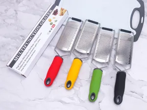 Stainless steel multi-function cheese grater detail showing sharp blade and ergonomic grip.