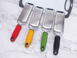 Stainless steel cheese grater lemon zester with colorful anti-slip handles for kitchen.