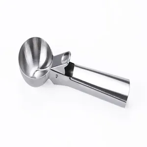 Close-up detail of stainless steel ice cream scoop with ergonomic trigger release mechanism.