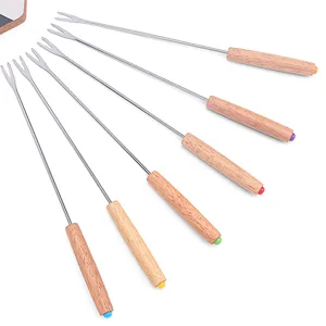 Details of the 6-piece cheese fondue fork set with wooden handle and stainless steel tines.