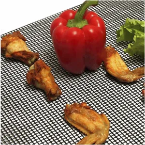 Non-stick BBQ grill mesh mat detail showing food placement for outdoor cooking and baking use.