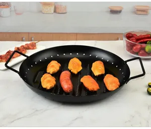 Round non-stick BBQ grill pan with handles for outdoor camping and home kitchen cooking detail.