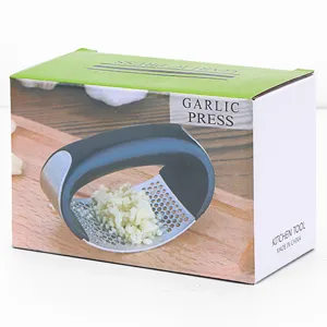 Stainless steel manual garlic press with ergonomic rocker design for kitchen use. Efficient and durable.