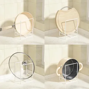 White metal kitchen storage rack, multi-functional organizer for pans, lids and cutting boards.