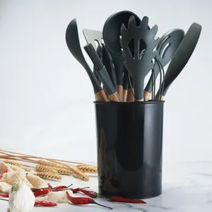 Detailed view of silicone kitchen utensils set featuring spatula and storage holder.