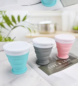 Details of portable silicone collapsible travel cup in blue gray pink colors with lid
