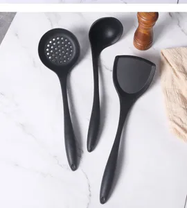 Silicone kitchen utensils set detail view featuring a slotted spoon, ladle, and spatula.