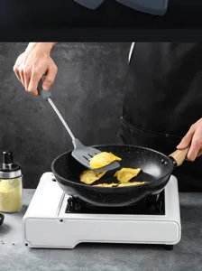 Silicone cooking spatula with stainless steel handle, ideal for non-stick cookware.